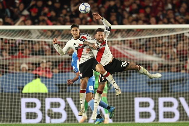 River Plate's defender #28 Lucas Martinez Quarta and River Plate's midfielder #30 Nicolas Otamendi jump for the ball during the Argentine Professional League 2026 Clausura tournament football match between River Plate and Estudiantes de Rio Cuarto at the Mas Monumental stadium in Buenos Aires on October 10, 2026. (Photo by Alejandro PAGNI / AFP)