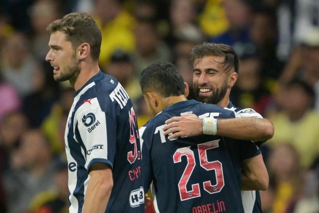 Monterrey's Uruguayan forward #09 Diego Rossi (R) celebrates scoring his team's first goal during the Liga MX Apertura tournament football match between Atlas and Guadalajara at Jalisco stadium in Guadalajara, Mexico, on October 10, 2026. (Photo by CARL DE SOUZA / AFP)