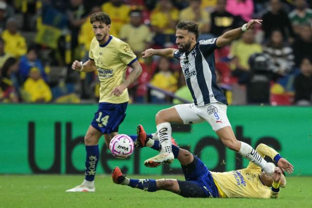 Monterrey's Uruguayan forward #09 Diego Rossi and America's midfielder #20 Alexis Gutierrez fight for the ball during the Liga MX Apertura tournament football match between America and Monterrey at Banorte stedium in Mexico City, on October 10, 2026. (Photo by CARL DE SOUZA / AFP)