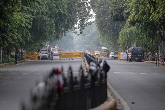 A general view shows a road blocked by authorities amid ongoing protests demanding the resignation of India's Chief Election Commissioner Gyanesh Kumar over alleged voter roll irregularities linked to the "special intensive revision" (SIR), near Jantar Mantar in New Delhi on October 11, 2026. A New Delhi court ordered on October 11 the release of three leaders of the "cockroach" movement, including its founder Abhijeet Dipke, their lawyer said, a day after they were detained. (Photo by Sajjad HUSSAIN / AFP)