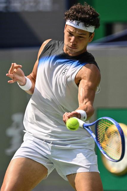 USA's Ben Shelton hits a return to France's Arthur Gea during their men's singles match at the Shanghai Masters tennis tournament in Shanghai on October 11, 2026. (Photo by Hector RETAMAL / AFP)