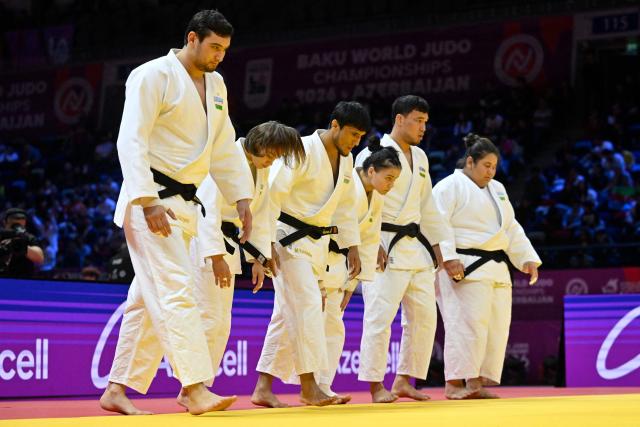 Uzbekistan's team arrives for the mixed team event at the World Judo Championships in Baku on October 11, 2026. (Photo by Alexander NEMENOV / AFP)