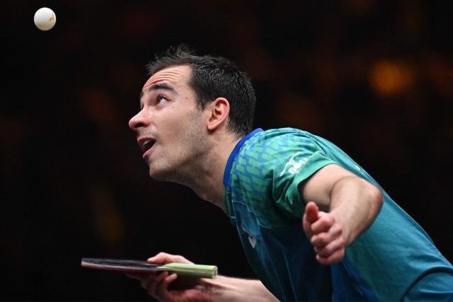 Brazil’s Hugo Calderano serves to Taiwan’s Lin Yun-ju during their men’s singles semi-final match at the China Smash 2026 table tennis tournament in Beijing on October 11, 2026. (Photo by ADEK BERRY / AFP)