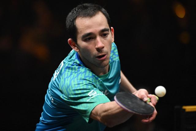 Brazil’s Hugo Calderano hits a return to Taiwan’s Lin Yun-ju during their men’s singles semi-final match at the China Smash 2026 table tennis tournament in Beijing on October 11, 2026. (Photo by ADEK BERRY / AFP)