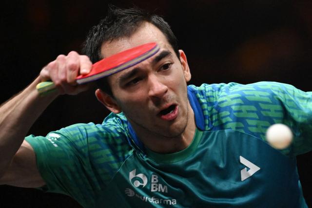 Brazil’s Hugo Calderano hits a return to Taiwan’s Lin Yun-ju during their men’s singles semi-final match at the China Smash 2026 table tennis tournament in Beijing on October 11, 2026. (Photo by ADEK BERRY / AFP)