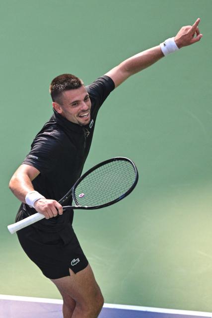 France's Arthur Gea celebrates after winning against USA's Ben Shelton during their men's singles match at the Shanghai Masters tennis tournament in Shanghai on October 11, 2026. (Photo by Hector RETAMAL / AFP)