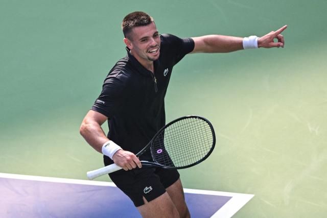 France's Arthur Gea celebrates after winning against USA's Ben Shelton during their men's singles match at the Shanghai Masters tennis tournament in Shanghai on October 11, 2026. (Photo by Hector RETAMAL / AFP)