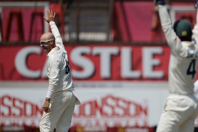 Australia's Nathan Lyon succesfully appeals for the wicket of South Africa's Temba Bavuma on day three of the first Test match between South Africa and Australia at the Kingsmead stadium in Durban on October 11, 2026. (Photo by Marco Longari / AFP)