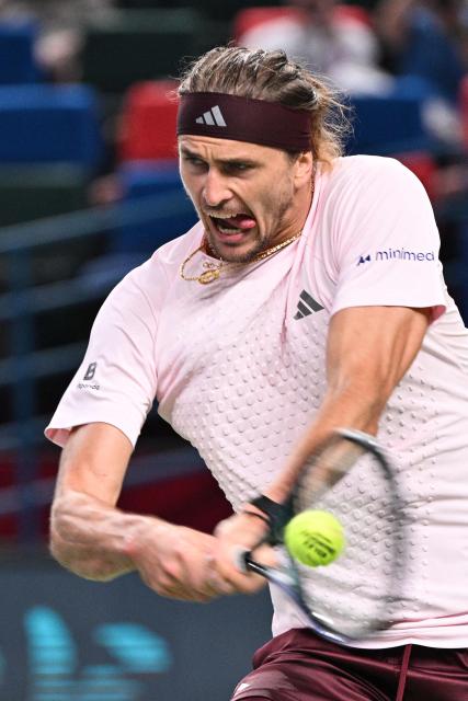 Germany's Alexander Zverev hits a return to France's Quentin Halys during their men's singles match at the Shanghai Masters tennis tournament in Shanghai on October 11, 2026. (Photo by Hector RETAMAL / AFP)