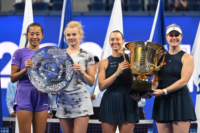 Brazil’s Luisa Stefani (3rd L) and Canada’s Gabriela Dabrowski (4th L) celebrate with the trophy after beating China’s Zhang Shuai (L) and Czech Republic’s Katerina Siniakova (2nd L) in the women’s doubles final at the China Open tennis tournament in Beijing on October 11, 2026. (Photo by GREG BAKER / AFP)