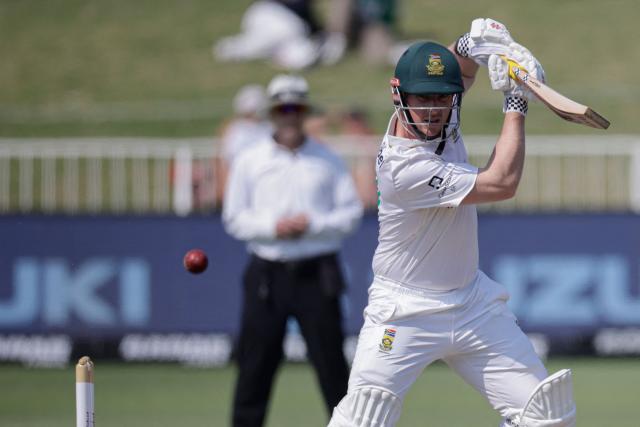 South Africa's Simon Harmer plays a shot on day three of the first Test match between South Africa and Australia at the Kingsmead stadium in Durban on October 11, 2026. (Photo by Marco Longari / AFP)