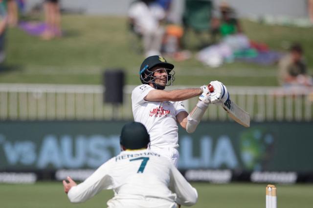 South Africa's Keshav Maharaj plays a shot on day three of the first Test match between South Africa and Australia at the Kingsmead stadium in Durban on October 11, 2026. (Photo by Marco Longari / AFP)