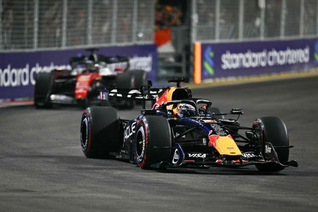 Red Bull Racing's Dutch driver Max Verstappen steers his car during the Formula One Singapore Grand Prix at the Marina Bay Street Circuit in Singapore on October 11, 2026. (Photo by ANTHONY WALLACE / AFP)