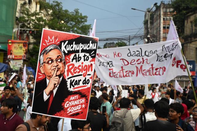 Student activists aligned with left-wing organisations hold a poster of India's Chief Election Commissioner Gyanesh Kumar amid the ongoing protest in solidarity with the youth-led Cockroach Janata Party (CJP) demanding his resignation over alleged voter roll irregularities linked to the "special intensive revision" (SIR), in Kolkata on October 11, 2026. (Photo by Dibyangshu SARKAR / AFP)