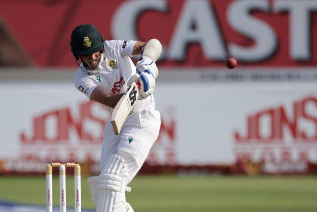 TOPSHOT - South Africa's Keshav Maharaj plays a shot on day three of the first Test match between South Africa and Australia at the Kingsmead stadium in Durban on October 11, 2026. (Photo by Marco Longari / AFP)