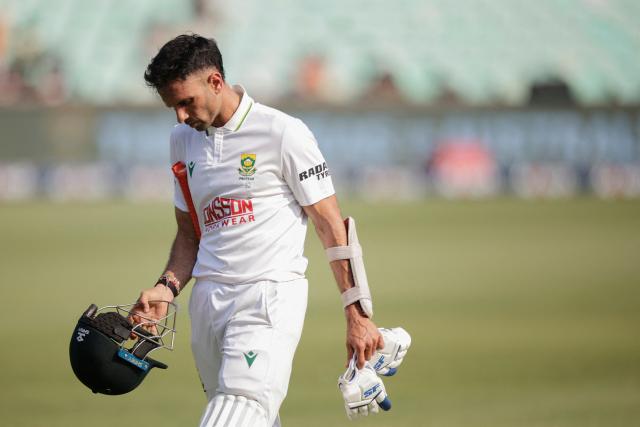 South Africa's Keshav Maharaj walks back to the pavilion after his dismissal on day three of the first Test match between South Africa and Australia at the Kingsmead stadium in Durban on October 11, 2026. (Photo by Marco Longari / AFP)
