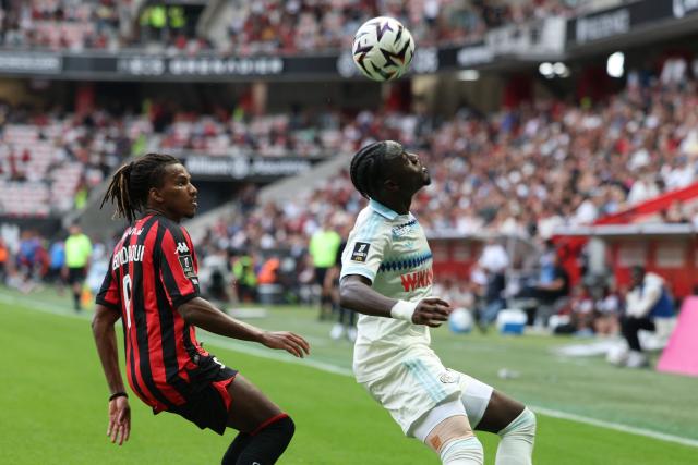 Nice's Algerian midfielder #06 Hicham Boudaoui (L) fights for the ball with Strasbourg's Swedish defender #16 Genesis Antwi (R) during the French L1 football match between OGC Nice and RC Strasbourg Alsace at the Allianz Riviera Stadium in Nice on October 11, 2026. (Photo by Valery HACHE / AFP)