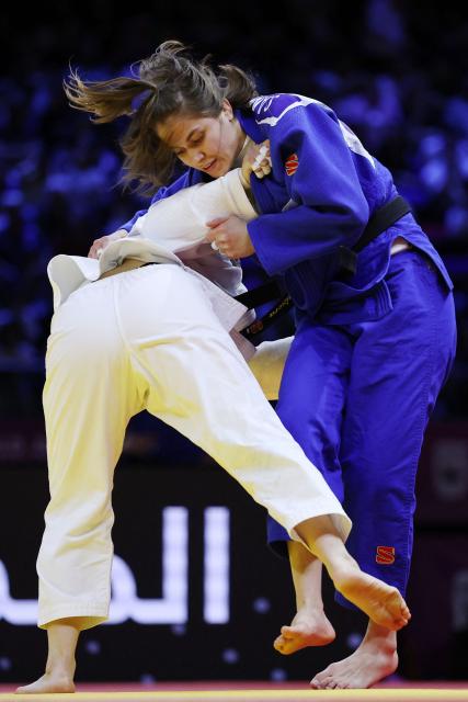 Mongolia's Sosorbaram Lkhagvasuren (white) competes against Uzbekistan's Shukurjon Aminova in the mixed team bronze medal bout at the World Judo Championships in Baku on October 11, 2026. (Photo by Anne-Christine POUJOULAT / AFP)