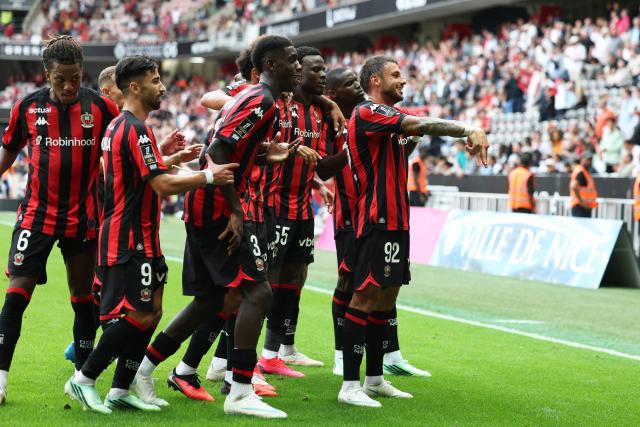 Nice's French defender #92 Jonathan Clauss (R) celebrates with teammates after scoring a goal during the French L1 football match between OGC Nice and RC Strasbourg Alsace at the Allianz Riviera Stadium in Nice on October 11, 2026. (Photo by Valery HACHE / AFP)