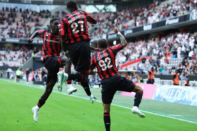 Nice's French defender #92 Jonathan Clauss (R) and teammates celebrate after scoring a goal during the French L1 football match between OGC Nice and RC Strasbourg Alsace at the Allianz Riviera Stadium in Nice on October 11, 2026. (Photo by Valery HACHE / AFP)