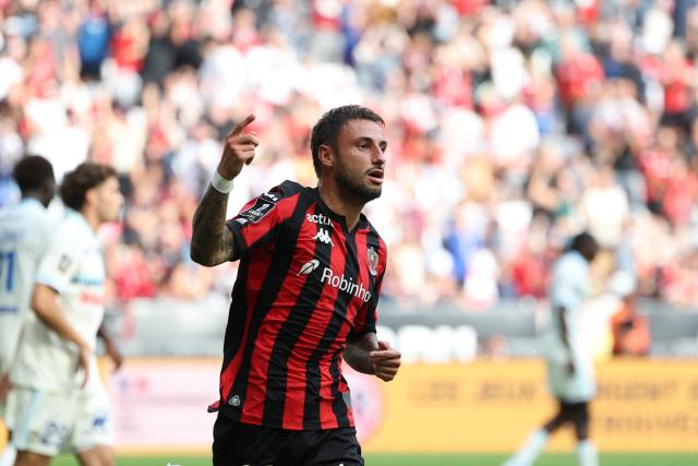 Nice's French defender #92 Jonathan Clauss celebrates after scoring a goal during the French L1 football match between OGC Nice and RC Strasbourg Alsace at the Allianz Riviera Stadium in Nice on October 11, 2026. (Photo by Valery HACHE / AFP)