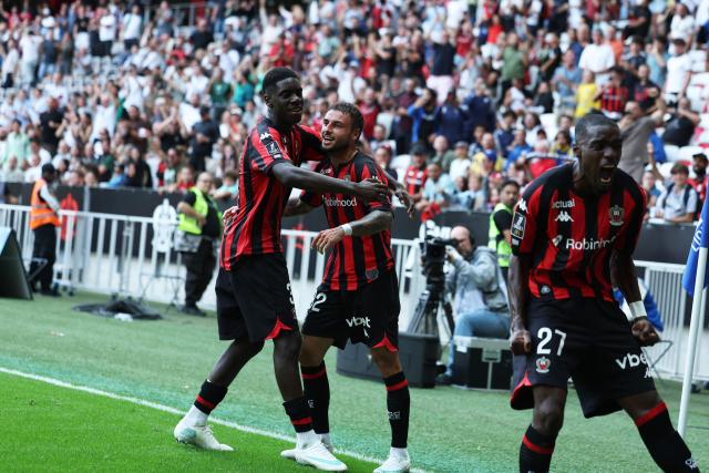 Nice's French defender #92 Jonathan Clauss (C) and teammates celebrate after scoring a goal during the French L1 football match between OGC Nice and RC Strasbourg Alsace at the Allianz Riviera Stadium in Nice on October 11, 2026. (Photo by Valery HACHE / AFP)