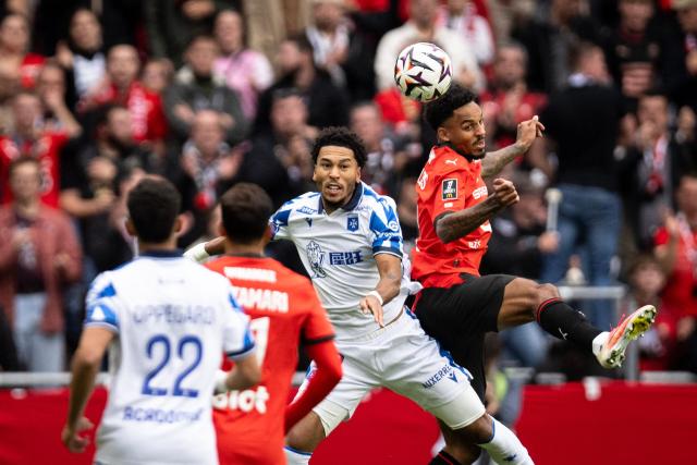 Auxerre's Cameroonian forward #10 Danny Namaso (C) and Rennes' American defender #14 Bryan Reynolds (R) fight for the ball in the air during the French L1 football match between Stade Rennais FC and AJ Auxerre at the Roazhon Park Stadium in Rennes, western France on October 11, 2026. Auxerre's Cameroonian forward #10 Danny Namaso and Rennes' American defender #14 Bryan Reynolds fight for the ball during the French L1 football match between Stade Rennais FC and AJ Auxerre at the Roazhon Park stadium in Rennes, western France, on October 11, 2026. (Photo by Guillaume SALIGOT / AFP)