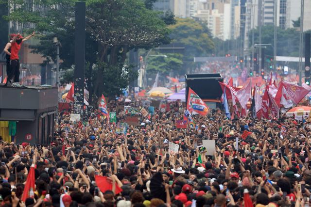 Supporters of Brazil's President and presidential candidate Luiz Inacio Lula da Silva of the Workers' Party (PT) attend a campaign rally in Sao Paulo, Brazil, on October 11, 2026, ahead of the presidential runoff election. (Photo by Miguel SCHINCARIOL / AFP)