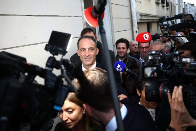Candidate in the Socialist (PS) and centre-left Place Publique (PP) parties primary Raphael Glucksmann arrives after the announcement of the result for the first round of voting in the primary organized by the Socialist Party, Place Publique (PP), and the Republican and Socialist Left, ahead of France's 2027 presidential election, in Paris on October 11, 2026. Candidate in the Socialist (PS) and centre-left Place Publique (PP) parties primary ahead of France's 2027 presidential election and MEP Raphaël Glucksmann was elected on October 11, 2026 as the Social Democratic lefts candidate for the French presidential election, winning more than 66 percent of the vote in the first round of a primary election that drew 120,787 voters, organizers announced. (Photo by ROMAIN PERROCHEAU / AFP)