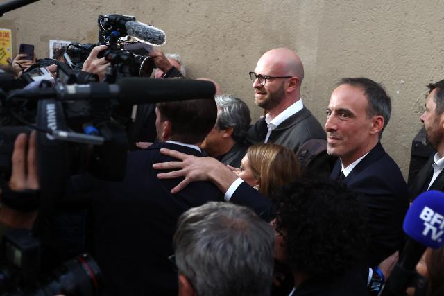 Candidate in the Socialist (PS) and centre-left Place Publique (PP) parties primary Raphael Glucksmann arrives after the announcement of the result for the first round of voting in the primary organized by the Socialist Party, Place Publique (PP), and the Republican and Socialist Left, ahead of France's 2027 presidential election, in Paris on October 11, 2026. Candidate in the Socialist (PS) and centre-left Place Publique (PP) parties primary ahead of France's 2027 presidential election and MEP Raphaël Glucksmann was elected on October 11, 2026 as the Social Democratic lefts candidate for the French presidential election, winning more than 66 percent of the vote in the first round of a primary election that drew 120,787 voters, organizers announced. (Photo by ROMAIN PERROCHEAU / AFP)