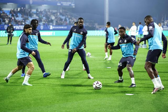 Marseille's players warm up ahead of the French L1 football match between ES Troyes AC and Olympique de Marseille (OM) at the Stade de l'Aube in Troyes, central France, on October 11, 2026. (Photo by Sameer Al-DOUMY / AFP)