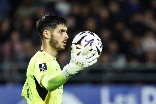 Troyes' French goalkeeper #01 Zacharie Boucher holds the ball during the French L1 football match between ES Troyes AC and Olympique de Marseille (OM) at the Stade de l'Aube in Troyes, central France, on October 11, 2026. (Photo by Sameer Al-DOUMY / AFP)