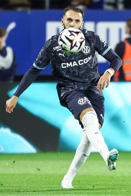 Marseille's Algerian forward #09 Amine Gouiri passes the ball during the French L1 football match between ES Troyes AC and Olympique de Marseille (OM) at the Stade de l'Aube in Troyes, central France, on October 11, 2026. (Photo by Sameer Al-DOUMY / AFP)
