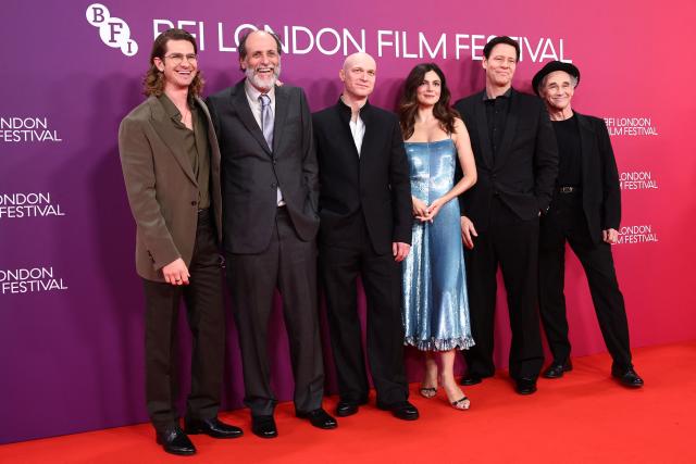 (L-R) British-US actor Andrew Garfield, Italian film director Luca Guadagnino, Russian actor Yura Borisov, US actor Monica Barbaro, US actor Ike Barinholtz and British actor Mark Rylance pose on the red carpet upon arrival to attend the International premiere of the film "Artificial" at the Royal Festival Hall in London, October 11, 2026, during the BFI London Film Festival. (Photo by Henry Nicholls / AFP)