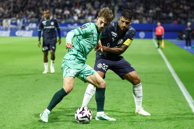 Troyes' French defender #02 Lucas Maronnier (L) fights for the ball with Marseille's Italian defender #33 Emerson (R) during the French L1 football match between ES Troyes AC and Olympique de Marseille (OM) at the Stade de l'Aube in Troyes, central France, on October 11, 2026. (Photo by Sameer Al-DOUMY / AFP)