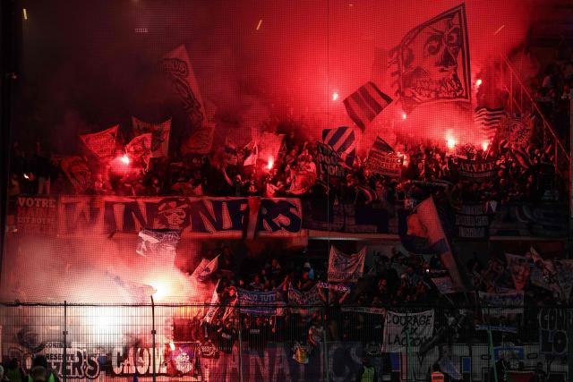 Marseille's supporters cheer their team  during the French L1 football match between ES Troyes AC and Olympique de Marseille (OM) at the Stade de l'Aube in Troyes, central France, on October 11, 2026. (Photo by Sameer Al-DOUMY / AFP)