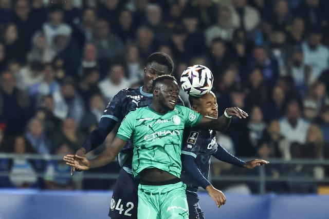 Troyes' Senegalese midfielder #08 Mouhamed Diop (C) vies with Marseille's Malian midfielder #42 Nouhoum Kamissoko (L) and Marseille's Brazilian forward #14 Igor Paixao (R) during the French L1 football match between ES Troyes AC and Olympique de Marseille (OM) at the Stade de l'Aube in Troyes, central France, on October 11, 2026. (Photo by Sameer Al-DOUMY / AFP)