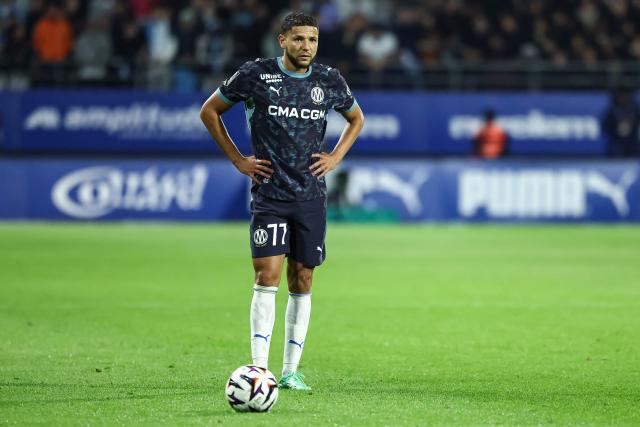 Marseille's Moroccan forward #77 Amine Harit concentrates before a free kick during the French L1 football match between ES Troyes AC and Olympique de Marseille (OM) at the Stade de l'Aube in Troyes, central France, on October 11, 2026. (Photo by Sameer Al-DOUMY / AFP)
