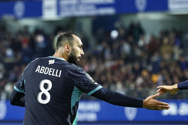 Marseille's Algerian midfielder #08 Himad Abdelli celebrates scoring his team's second goal during the French L1 football match between ES Troyes AC and Olympique de Marseille (OM) at the Stade de l'Aube in Troyes, central France, on October 11, 2026. (Photo by Sameer Al-DOUMY / AFP)