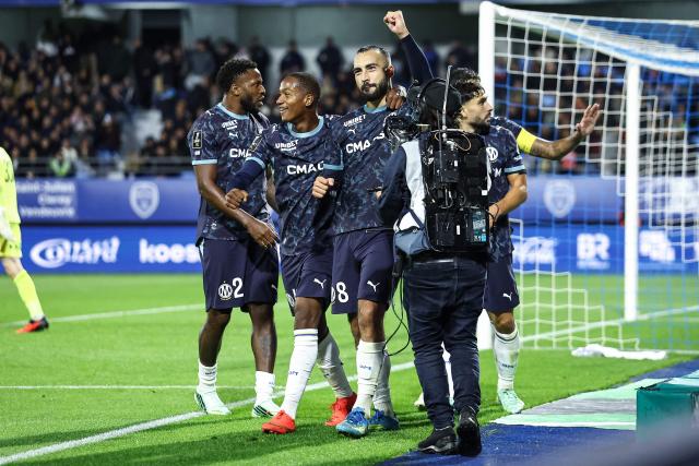 Marseille's Algerian midfielder #08 Himad Abdelli (C) celebrates scoring his team's second goal during the French L1 football match between ES Troyes AC and Olympique de Marseille (OM) at the Stade de l'Aube in Troyes, central France, on October 11, 2026. (Photo by Sameer Al-DOUMY / AFP)