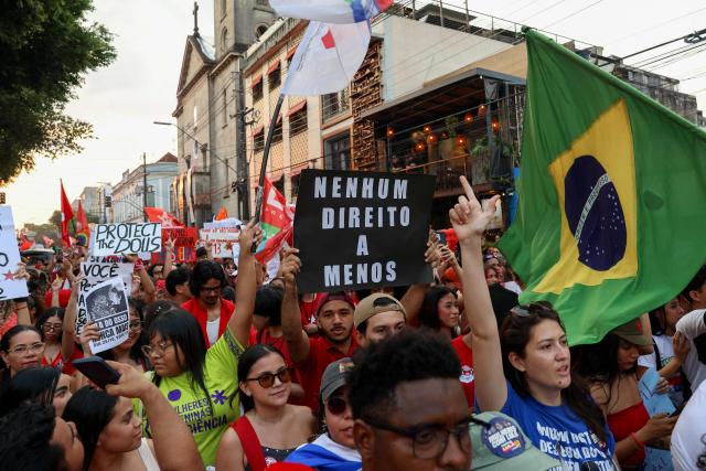 Supporters of Brazilian President and presidential candidate Luiz Inacio Lula da Silva of the Workers' Party (PT) take part in a rally in downtown Manaus, in the state of Amazonas, northern Brazil, on October 11, 2026, ahead of the presidential election. (Photo by MICHAEL DANTAS / AFP)