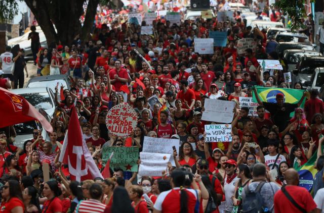 Supporters of Brazilian President and presidential candidate Luiz Inacio Lula da Silva of the Workers' Party (PT) take part in a rally in downtown Manaus, in the state of Amazonas, northern Brazil, on October 11, 2026, ahead of the presidential election. (Photo by MICHAEL DANTAS / AFP)