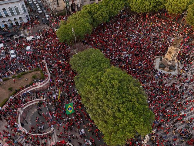 This aerial view shows supporters of Brazilian President and presidential candidate Luiz Inácio Lula da Silva of the Workers' Party (PT) attending a rally in downtown Manaus, in the state of Amazonas, northern Brazil, on October 11, 2026, ahead of the presidential runoff election. (Photo by MICHAEL DANTAS / AFP)