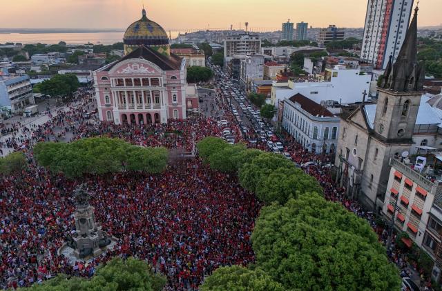 This aerial view shows supporters of Brazilian President and presidential candidate Luiz Inácio Lula da Silva of the Workers' Party (PT) attending a rally in downtown Manaus, in the state of Amazonas, northern Brazil, on October 11, 2026, ahead of the presidential runoff election. (Photo by MICHAEL DANTAS / AFP)