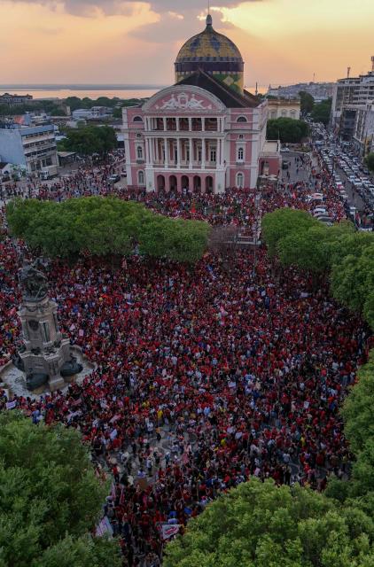 This aerial view shows supporters of Brazilian President and presidential candidate Luiz Inácio Lula da Silva of the Workers' Party (PT) attending a rally in downtown Manaus, in the state of Amazonas, northern Brazil, on October 11, 2026, ahead of the presidential runoff election. (Photo by MICHAEL DANTAS / AFP)