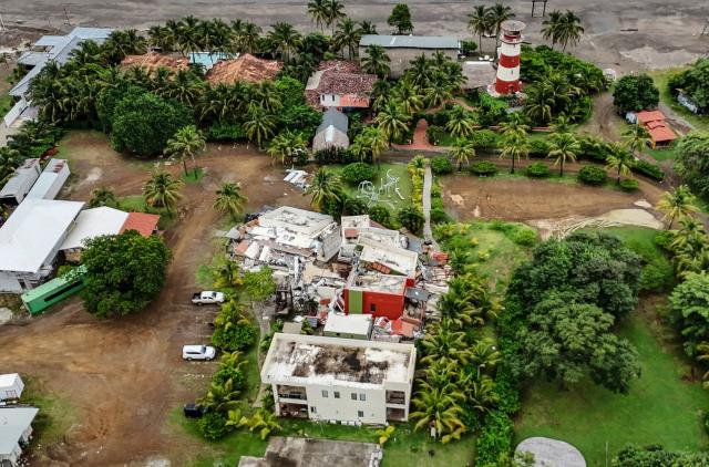 This aerial view shows a partially destroyed house in Playa Venao, Los Santos province, about 360 km southwest of Panama City, on October 11, 2026. A powerful 7.7-magnitude earthquake rocked Panama on October 9, 2026, collapsing buildings and roads in the center of the country and injuring at least 27 people, with no deaths reported. (Photo by DANIEL DE CARTERET / AFP)