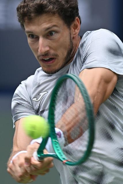 Spain’s Pablo Carreno Busta hits a return to Canada’s Felix Auger-Aliassime during their men's singles match at the Shanghai Masters tennis tournament in Shanghai on October 12, 2026. (Photo by CN-STR / AFP) / China OUT