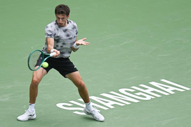 Spain’s Pablo Carreno Busta hits a return to Canada’s Felix Auger-Aliassime during their men's singles match at the Shanghai Masters tennis tournament in Shanghai on October 12, 2026. (Photo by CN-STR / AFP) / China OUT