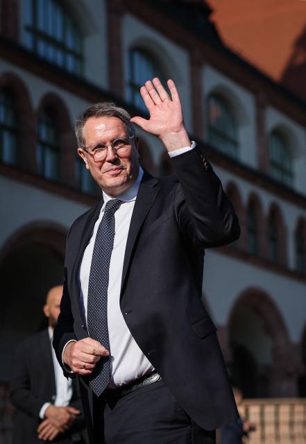 (FILES) Then Rhineland-Palatinate's State Premier Alexander Schweitzer waves as he arrives prior to a meeting of the leaders of the German federal states in Leipzig, eastern Germany on October 24, 2024. Following the resignation of Baerbel Bas (SPD) as Germany's labour minister, former Rhineland-Palatinate state premier Alexander Schweitzer (SPD) is to become her successor in the cabinet. This was confirmed to AFP by party sources on October 12, 2026. Bas had previously announced her resignation from the co-leadership of the party and from her ministerial post. (Photo by Ronny HARTMANN / AFP)