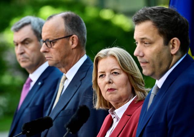 (FILES) (L-R) Bavaria's State Premier and leader of the conservative Christian Social Union (CSU) Markus Soeder, German Chancellor Friedrich Merz (CDU), German Minister for Labour and Social Affairs Baerbel Bas (SPD) and German Finance Minister and Vice Chancellor Lars Klingbeil (SPD) address a press conference, on July 2, 2026 in the garden of the Chancellery in Berlin, one day after their coalition committee consultations on a major package of reforms. Baerbel Bas is stepping down as SPD leader and federal labor minister. In a statement published on October 12, 2026, she also held the coalition partner, the CDU/CSU, responsible. Leading SPD politicians reacted with dismay. (Photo by Tobias SCHWARZ / AFP)